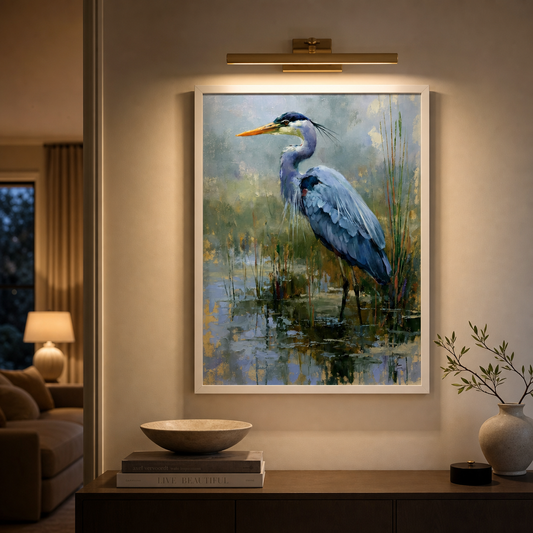 Blue Heron wall art evenly illuminated by a brass picture light