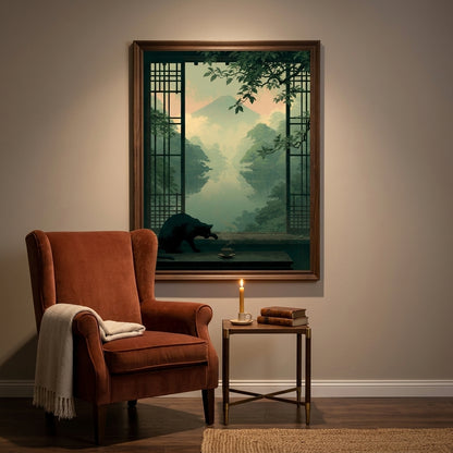 A framed art print depicting a serene Japanese-style landscape with a bear, hung on a beige wall above a rust-brown wingback armchair and a small side table with a candle.