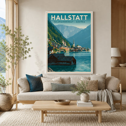 A framed travel poster of Hallstatt, Salzburg, Austria, displayed on a beige wall above a modern light wood sofa in a styled living room setting.